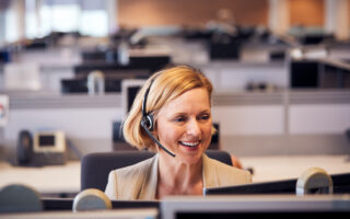 Business woman on phone smiling