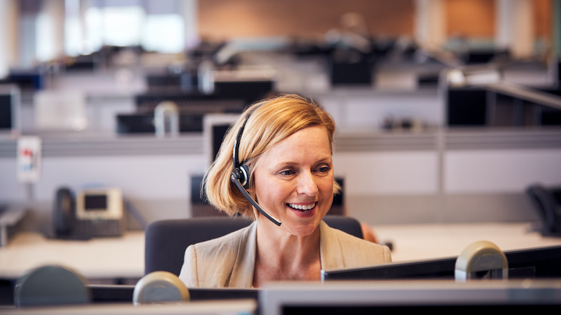 Business woman on phone smiling